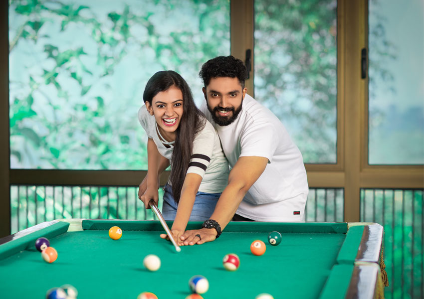 Couple Playing Billiards